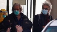 Members of the World Health Organisation (WHO) team tasked with investigating the origins of the coronavirus disease (COVID-19) pandemic leave their quarantine hotel in Wuhan, Hubei province, China January 28, 2021. REUTERS/Thomas Peter
