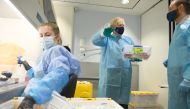 British Prime Minister Boris Johnson is shown the Lighthouse Laboratory used for processing PCR samples, during a visit to the Queen Elizabeth University Hospital campus in Glasgow, Scotland, Britain January 28, 2021. Jeff J Mitchell/Pool via REUTERS
