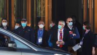 Members of the World Health Organisation (WHO) team tasked with investigating the origins of the coronavirus disease (COVID-19) prepare to leave a hotel in Wuhan, Hubei province, China January 29, 2021. REUTERS/Thomas Peter

