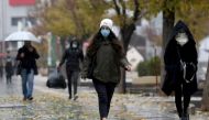 People walk on a street after Tehran reopened following a two-week shutdown, amid the coronavirus disease (COVID-19), Iran December 6, 2020. Majid Asgaripour/WANA (West Asia News Agency) via Reuters 
