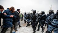 People are seen in front of law enforcement officers during a rally in support of jailed Russian opposition leader Alexei Navalny in Moscow, Russia January 31, 2021. REUTERS/Maxim Shemetov