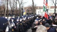 Police officers line up as people gather during a demonstration against the coronavirus disease (COVID-19) measures and their economic consequences in Vienna, Austria, January 31, 2021. REUTERS/Lisi Niesner
