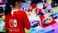An event employee of Nintendo attends the presentation ceremony of its game console Switch in Tokyo, Japan January 13, 2017. Reuters/Kim Kyung-Hoon/File Photo