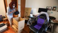 FILE PHOTO: Ines Alcolea places objects inside moving boxes before leaving her rented apartment in Madrid, Spain, October 28, 2020. Picture taken on October 28, 2020. REUTERS/Sergio Perez