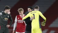 Arsenal manager Mikel Arteta, Arsenal's Martin Odegaard, Manchester United's Victor Lindelof and Manchester United's David de Gea after the match Pool via REUTERS/Alastair Grant 