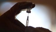 FILE PHOTO: A healthcare worker draws the coronavirus disease (COVID-19) vaccine from a vial at Mission Commons assisted living community in Redlands, California, U.S., January 15, 2021. REUTERS/Lucy Nicholson
