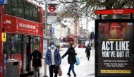 People get off the bus on Ealing's high street where the new SARS-CoV-2 coronavirus variant originating from South Africa has been located, in West London, Britain February 2, 2021. Reuters/Henry Nicholls/File Photo