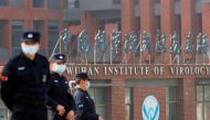 Security personnel keep watch outside the Wuhan Institute of Virology during the visit by the World Health Organization (WHO) team tasked with investigating the origins of the coronavirus disease (COVID-19), in Wuhan, Hubei province, China February 3, 202