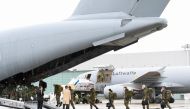 Staff members enter aboard an A400M military transport plane to COVID-19 stricken Portugal in Wunstorf, Germany, February 3, 2021. REUTERS/Fabian Bimmer