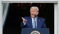 FILE PHOTO: US President Donald Trump stands on a White House balcony speaking to supporters gathered on the South Lawn for a campaign rally that the White House is calling a 
