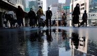 Pedestrians wearing protective masks amid the coronavirus disease (COVID-19) outbreak, make their way in Tokyo, Japan, February 2, 2021. REUTERS/Kim Kyung-Hoon
