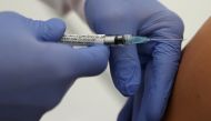 Professor Gottfried Kremsner injects a vaccination against the coronavirus disease (COVID-19) from German biotechnology company CureVac to a volunteer at the start of a clinical test series at his tropical institute of the university clinic in Tuebingen, 