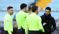 Arsenal manager Mikel Arteta with referee Chris Kavanagh and the assistant referees after the match Pool via REUTERS/Nick Potts