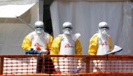 FILE PHOTO: Health workers dressed in protective suits are seen at the newly constructed MSF(Doctors Without Borders) Ebola treatment centre in Goma, Democratic Republic of Congo, August 4, 2019.REUTERS/Baz Ratner
