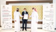 Manateq CEO, Fahad Rashid Al Kaabi, receiving the certificate.