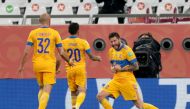 Tigres UANL's Andre Pierre Gignac celebrates scoring their first goal with Javier Aquino and Carlos Gonzalez REUTERS/Mohammed Dabbous
