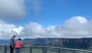 People look at the Blue Mountains from the Echo Point lookout in the Blue Mountains, New South Wales, Australia, February 2, 2021. REUTERS/Stefica Nicole Bikes