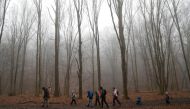 Tibor Miklosi and his family hike on National Blue Trail along the Pilis Mountains, during the coronavirus disease (COVID-19) pandemic, near Pilisszentlaszlo, Hungary, February 6, 2021. Picture taken February 6, 2021. REUTERS/Bernadett Szabo
