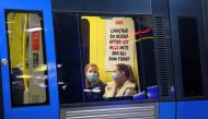 Passengers wearing protective masks sit onboard an underground train, amid the spread of the coronavirus disease (COVID-19) pandemic, in Stockholm, Sweden, January 7, 2021. Jessica Gow/TT News Agency/via REUTERS
