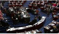 The U.S. Senate votes on the rules to govern the trial as it begins the second impeachment trial of former U.S. President Donald Trump, on charges of inciting the deadly attack on the U.S. Capitol, on the floor of the Senate chamber on Capitol Hill in Was