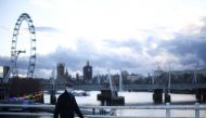 A person walks over Waterloo Bridge, amidst the coronavirus disease (COVID-19) outbreak in London, Britain, February 5, 2021. REUTERS/Henry Nicholls
