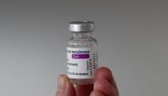 A member of the medical staff holds a vial of the Oxford-AstraZeneca COVID-19 vaccine at the Foch hospital in Suresnes, near Paris, France, February 8, 2021. REUTERS/Benoit Tessier/File Photo