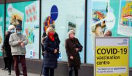 People queue to receive the coronavirus disease (COVID-19) vaccine outside a closed down Debenhams store that is being used as a vaccination centre in Folkestone, Kent, Britain January 28, 2021. REUTERS/Andrew Couldridge/File Photo