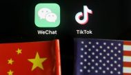 FILE PHOTO: The messenger app WeChat and short-video app TikTok are seen near China and U.S. flags in this illustration picture taken August 7, 2020. REUTERS/Florence Lo/Illustration

