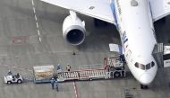 An aerial view shows an All Nippon Airways (ANA) plane, carrying the first batch of the coronavirus disease (COVID-19) vaccine developed by Pfizer Inc. arrives from Brussels at Narita airport in Narita, east of Tokyo, Japan February 12, 2021. Mandatory cr