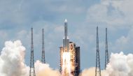 The Long March 5 Y-4 rocket, carrying an unmanned Mars probe of the Tianwen-1 mission, takes off from Wenchang Space Launch Center in Wenchang, Hainan Province, China July 23, 2020. REUTERS/Carlos Garcia Rawlins/File Photo