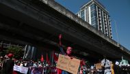 A protestor wearing a Spiderman costume gives the three-finger salute as he rallies against the military coup and to demand the release of elected leader Aung San Suu Kyi, in Yangon, Myanmar, February 10, 2021. REUTERS/Stringer