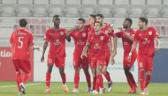 Al Duhail players celebrating their victory against Al Rayyan.