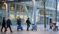 Travellers arrive at Heathrow Airport, as Britain introduces hotel quarantine programme for arrivals from a 