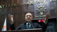 Turkish President Tayyip Erdogan addresses members of parliament from his ruling AK Party (AKP) during a meeting at the Turkish parliament in Ankara, Turkey, February 10, 2021. Murat Cetinmuhurdar 