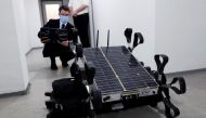 Matyas Hazadi, head of electric engineering of Puli Space Technologies tests the moon robot 'Puli Rover' in Budapest, Hungary, February 10, 2021. Picture taken February 10, 2021. REUTERS/Bernadett Szabo