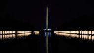 The Washington Monument is seen reflected after President-elect Joe Biden hosts a memorial to honor those who died from coronavirus disease (COVID-19), at the reflecting pool at the Lincoln Memorial, in Washington, U.S., January 19, 2021.    REUTERS/Calla
