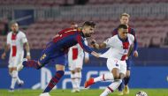 Soccer Football - Champions League - Round of 16 First Leg - FC Barcelona v Paris St Germain - Camp Nou, Barcelona, Spain - February 16, 2021 Paris St Germain's Kylian Mbappe in action with Barcelona's Gerard Pique REUTERS/Albert Gea
