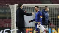 Barcelona's Lionel Messi with Paris St Germain coach Mauricio Pochettino after the match REUTERS/Albert Gea