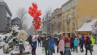 People walk in a street after the loosening of the coronavirus disease (COVID-19) restrictions in the resort town of Zakopane, Poland February 12, 2021. Picture taken February 12, 2021. Marek Podmokly /Agencja Gazeta via REUTERS