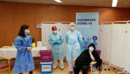 Balafia nursing home resident Milagros Garcia, 79, prepares to receive an injection with a dose of the Pfizer-BioNTech COVID-19 vaccine in Lleida, Catalonia, Spain, December 27, 2020. REUTERS/Albert Gea/File Photo