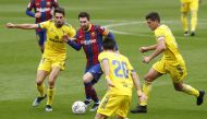 Soccer Football - La Liga Santander - FC Barcelona v Cadiz - Camp Nou, Barcelona, Spain - February 21, 2021 Barcelona's Lionel Messi in action with Cadiz's Ruben Sobrino REUTERS/Albert Gea
