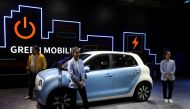 Models pose next to Great Wall Motors (GWM) GWM R1 electric car at its pavilion at the India Auto Expo 2020 in Greater Noida, India, February 5, 2020. REUTERS/Anushree Fadnavis/File Photo