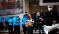 Demonstrators stand next to police officers as Greek hospital doctors and staff take part in a demonstration against a lack of intensive care units at public hospitals, amidst the spread of the coronavirus disease (COVID-19) in Athens, Greece, February 23