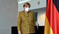 German Chancellor Angela Merkel walks to hold a news conference following a virtual summit with G7 leaders at the Chancellery in Berlin, Germany, February 19, 2021. REUTERS/Annegret Hilse/Pool
