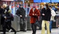 FILE PHOTO: Passengers wearing protective masks enter an underground railway station, amid the spread of the coronavirus disease (COVID-19) pandemic, in Stockholm, Sweden, January 7, 2021. Jessica Gow/TT News Agency/via REUTERS

