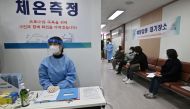 Nursing home workers (R) wait to receive the first dose of the AstraZeneca Covid-19 vaccine at a health care centre in Seoul on February 26, 2021, as South Korea starts coronavirus vaccination campaign. Jung Yeon-je/Pool via REUTERS