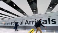 FILE PHOTO: Travellers at Heathrow airport, London, Britain, February 13, 2021. REUTERS/Toby Melville/File Photo
