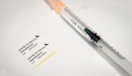 FILE PHOTO: A syringe for the AstraZeneca's COVID-19 vaccine is pictured during the opening of a vaccination centre at Berlin's former Tegel TXL airport, amid the spread of the coronavirus disease (COVID-19), in Berlin, Germany, February 10, 2021. Kay Nie