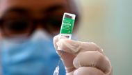 FILE PHOTO: A healthcare worker prepares to administer a dose of the Oxford University-AstraZeneca vaccine, marketed by the Serum Institute of India (SII) as COVISHIELD, against the coronavirus disease (COVID-19), in Santiago, Dominican Republic February 