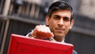 Britain's Chancellor of the Exchequer Rishi Sunak holds the budget box outside Downing Street in London, Britain, March 3, 2021. REUTERS/John Sibley TPX IMAGES OF THE DAY